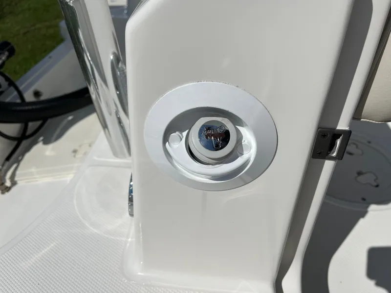 Slide: The Image of 2024 Boston Whaler 230 Outrage boat detail, featuring a chrome fixture on a white surface. - 28