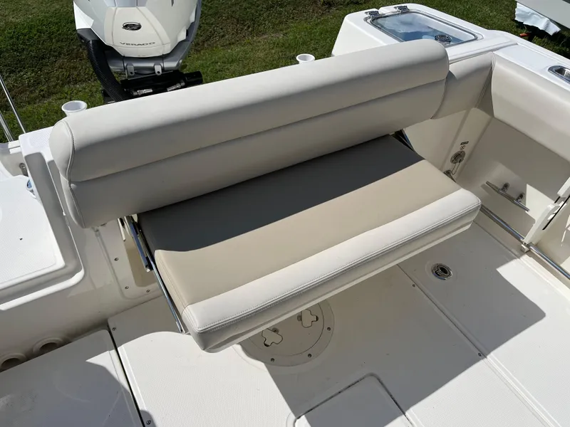Slide: The Image of 2024 Boston Whaler 230 Outrage boat seat, beige upholstery, rear view. - 29