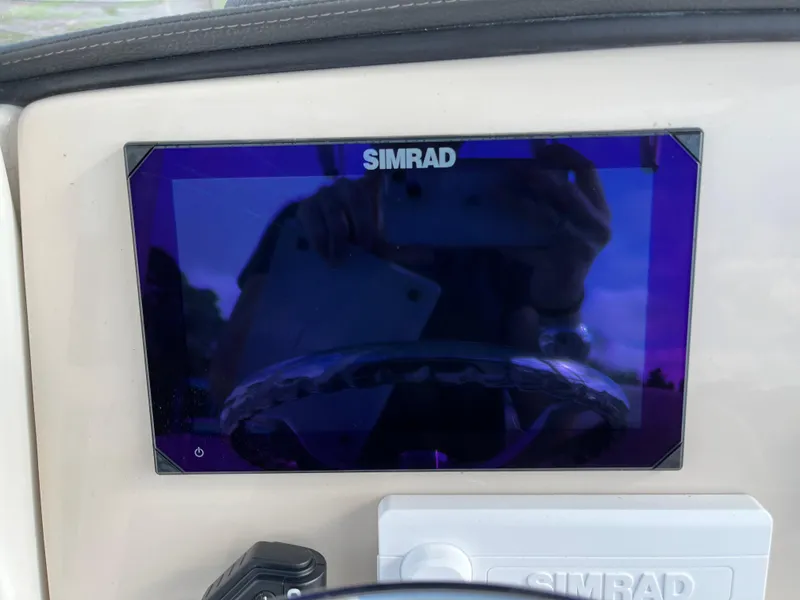 Slide: The Image of Simrad display on 2024 Boston Whaler 230 Outrage boat dashboard. - 6