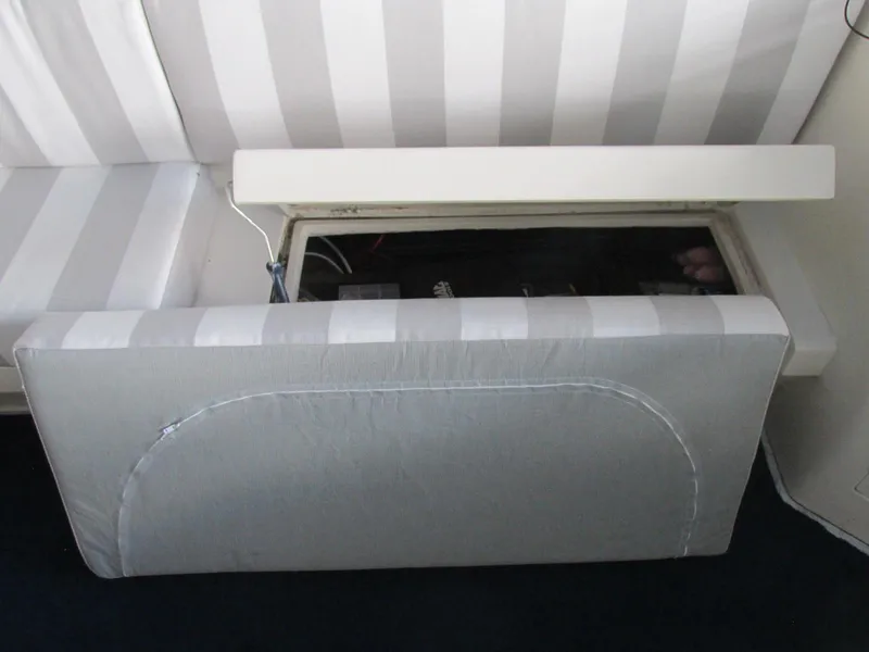 Slide: The Image of Cushioned seating with storage compartment on 1988 Vista 49 Motor Yacht. - 36