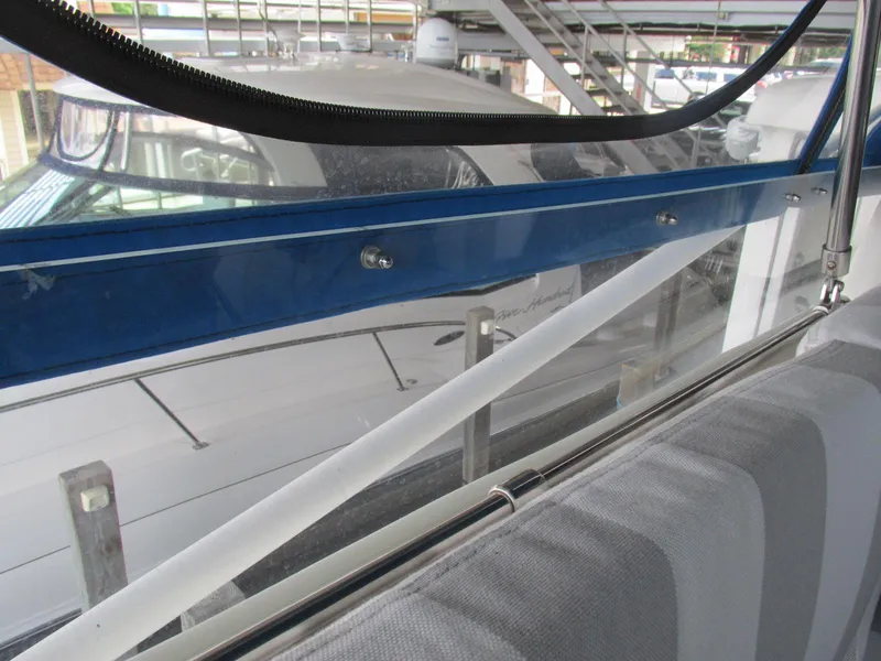 Slide: The Image of 1988 Vista 49 Motor Yacht interior view with blue trim and striped seating. - 37