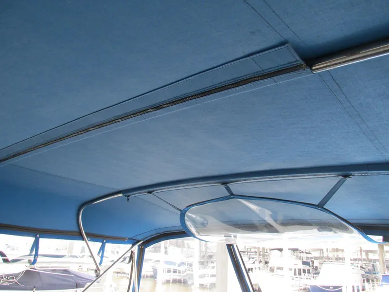Slide: The Image of Blue canopy interior of 1988 Vista 49 Motor Yacht at marina. - 39