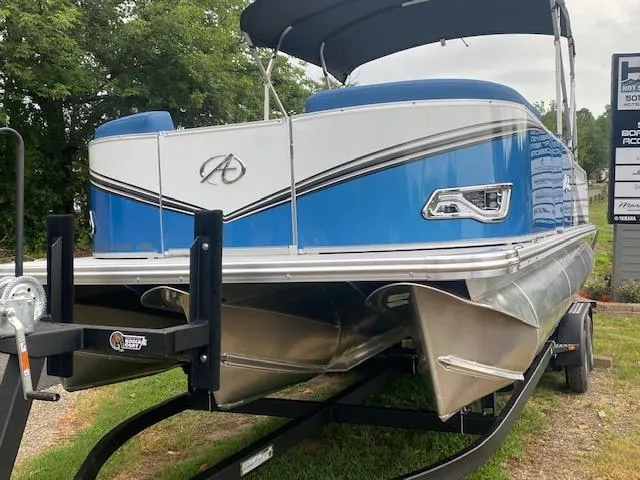 Slide: The Image of 2024 Avalon LSZ 2385 VRL pontoon boat on trailer, blue and white design. - 10