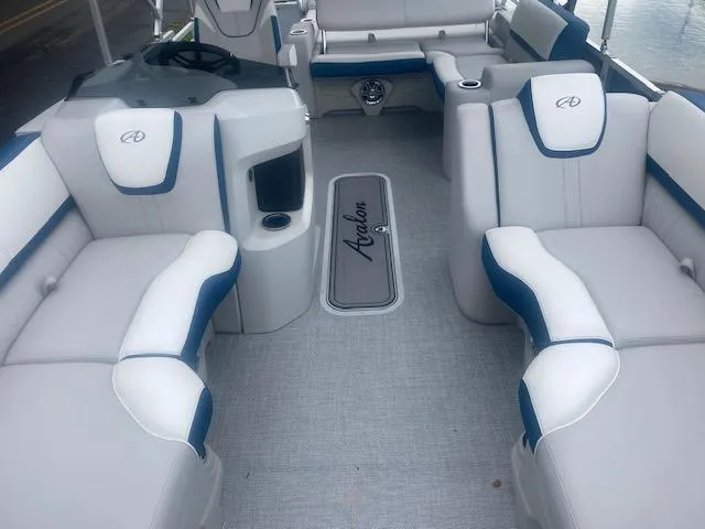 Slide: The Image of 2024 Avalon LSZ 2385 VRL boat interior with plush seating and modern design. - 12
