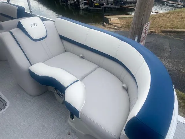 Slide: The Image of 2024 Avalon LSZ 2385 VRL boat with luxurious white and blue seating. - 13