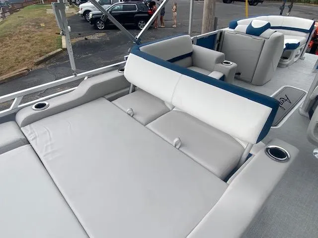 Slide: The Image of 2024 Avalon LSZ 2385 VRL boat interior with comfortable seating and cup holders. - 17