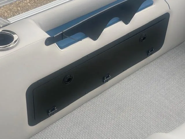 Slide: The Image of 2024 Avalon LSZ 2385 VRL boat interior storage compartment with cup holder. - 21