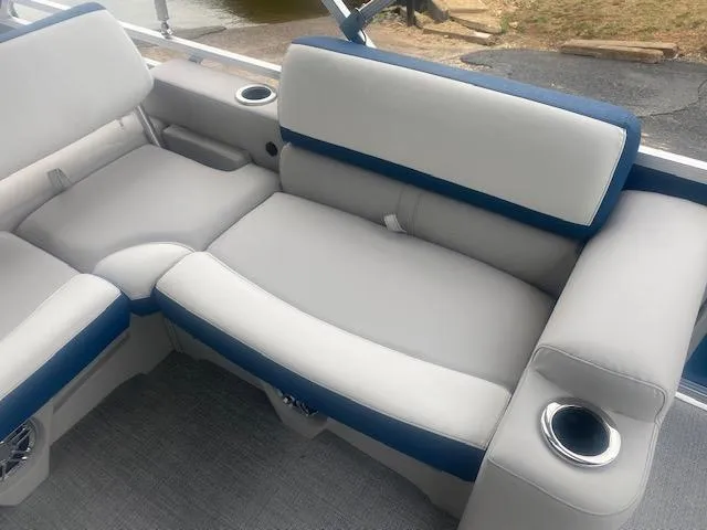 Slide: The Image of 2024 Avalon LSZ 2385 VRL boat interior with plush seating and cup holders. - 22