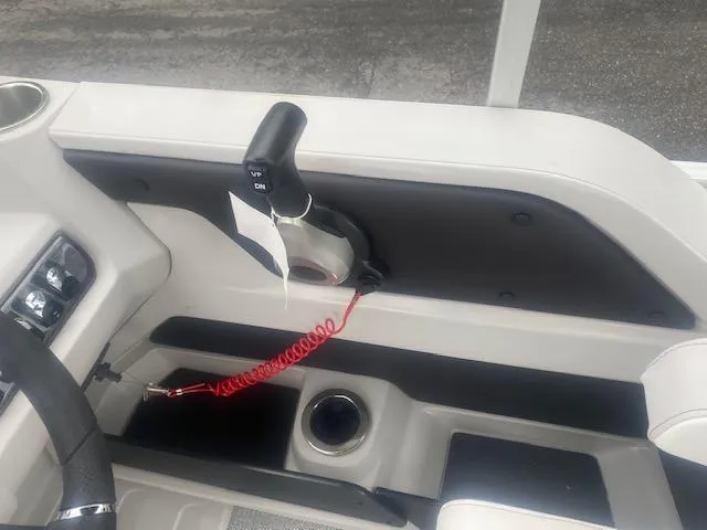 Slide: The Image of 2024 Avalon LSZ 2385 VRL boat control panel with throttle and safety lanyard. - 24