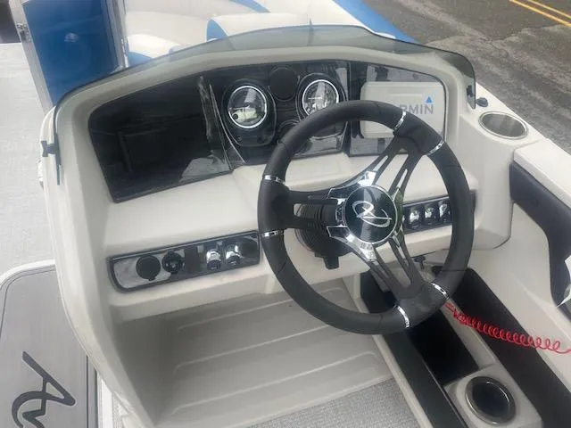 Slide: The Image of 2024 Avalon LSZ 2385 VRL boat dashboard with steering wheel and controls. - 26