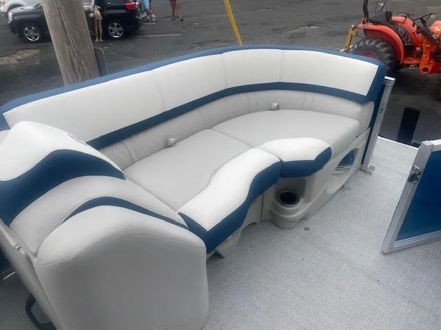 Slide: The Image of 2024 Avalon LSZ 2385 VRL boat interior with white and blue seating. - 27