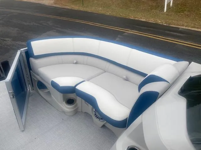 Slide: The Image of 2024 Avalon LSZ 2385 VRL boat with stylish white and blue seating. - 28