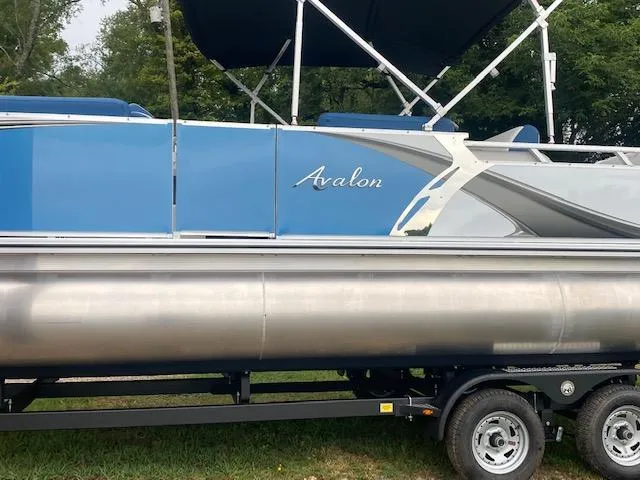 Slide: The Image of 2024 Avalon LSZ 2385 VRL pontoon boat with blue exterior on trailer. - 3