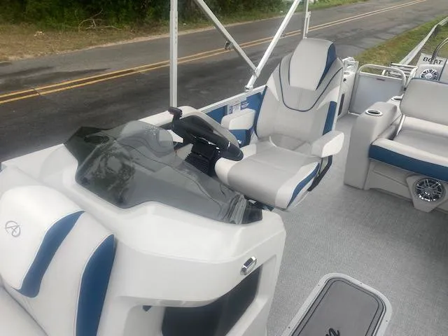 Slide: The Image of 2024 Avalon LSZ 2385 VRL boat interior with modern helm and seating. - 30