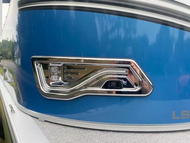 Slide: The Image of 2024 Avalon LSZ 2385 VRL boat, blue exterior with chrome detailing. - 5