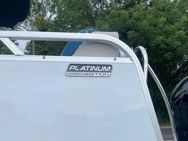 Slide: The Image of 2024 Avalon LSZ 2385 VRL Platinum Edition boat with sleek design and chrome accents. - 9