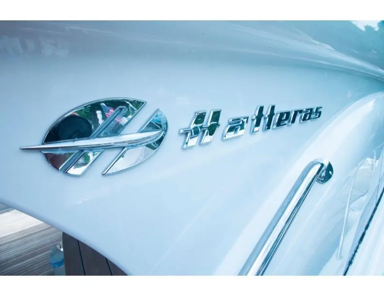 Slide: The Image of Close-up of 2006 Hatteras 64 Motor Yacht logo on white hull. - 17