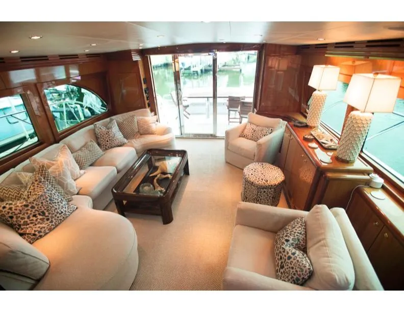 Slide: The Image of Luxurious interior of 2006 Hatteras 64 Motor Yacht with elegant seating and decor. - 27
