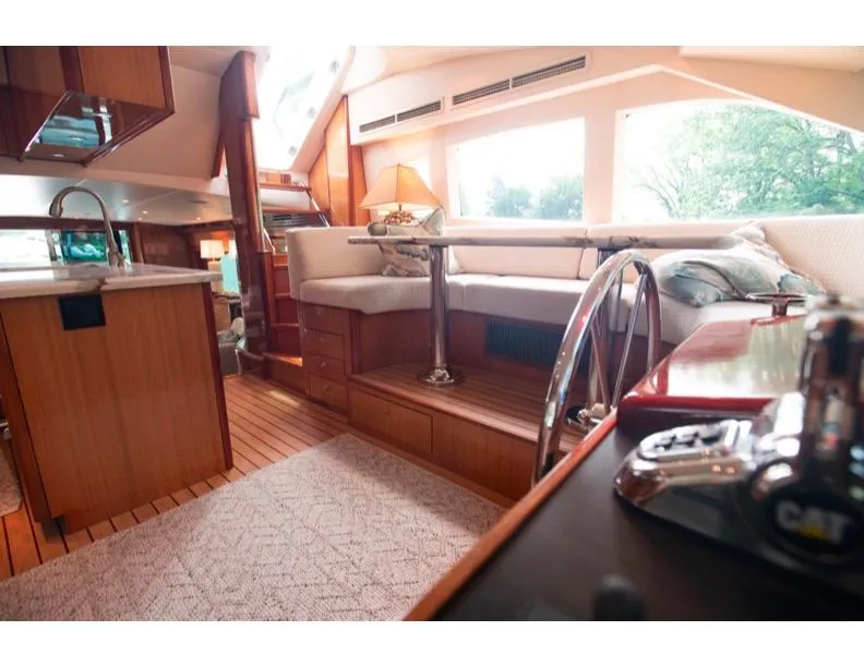 Slide: The Image of Luxurious interior of 2006 Hatteras 64 Motor Yacht with elegant wood finishes. - 30