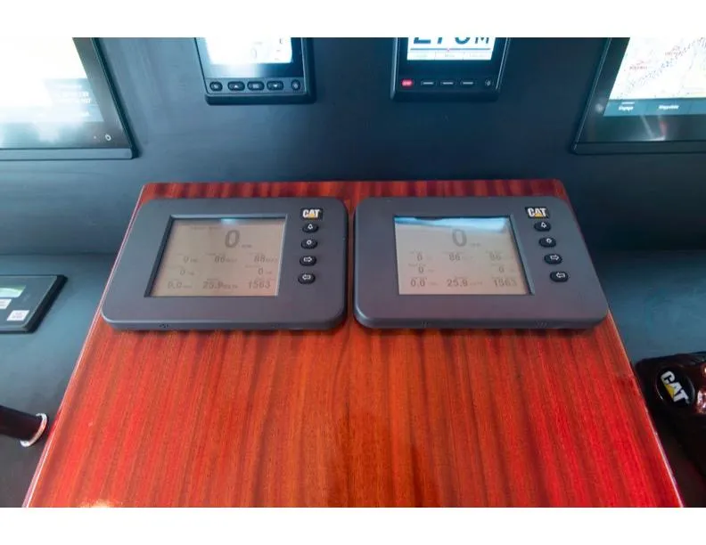 Slide: The Image of Dashboard of 2006 Hatteras 64 Motor Yacht with dual CAT displays. - 32