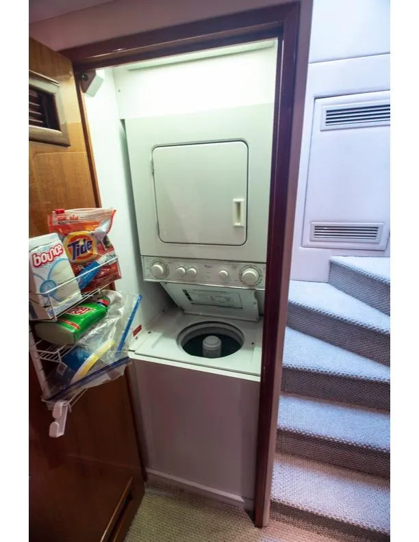 Slide: The Image of Laundry area in 2006 Hatteras 64 Motor Yacht with stacked washer and dryer. - 39