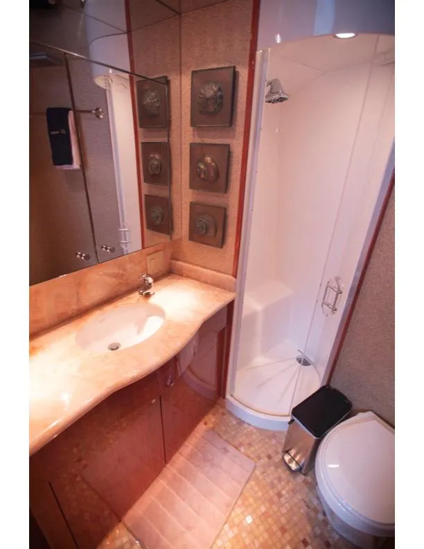 Slide: The Image of Luxurious bathroom in 2006 Hatteras 64 Motor Yacht with modern fixtures and elegant design. - 45