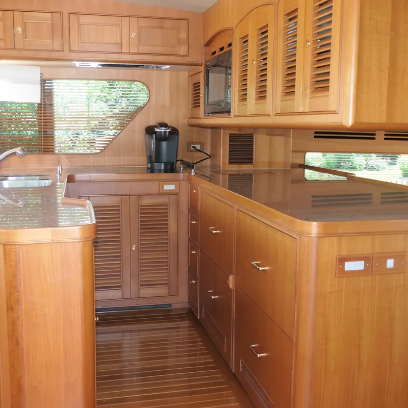 Slide: The Image of Luxurious wooden kitchen interior of 2008 Marlow 53 C Explorer yacht. - 6