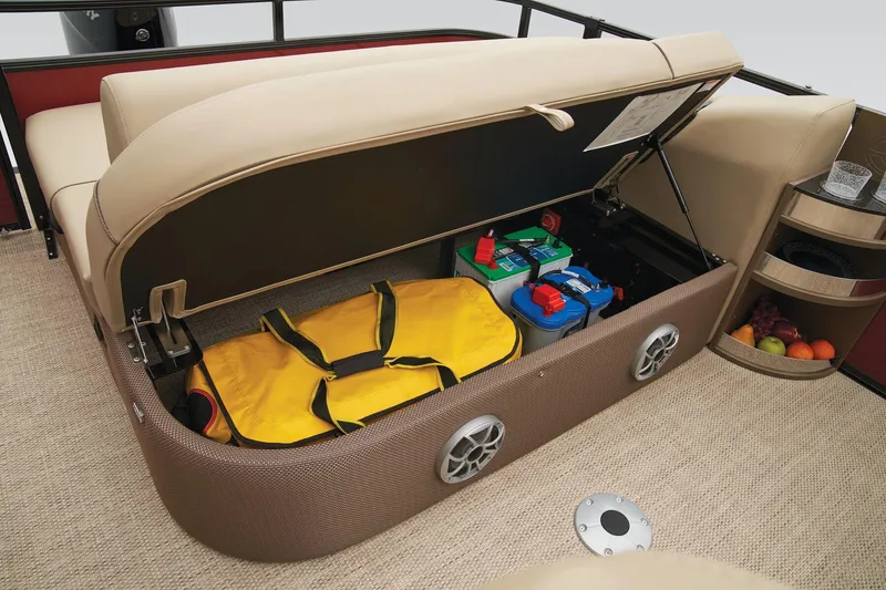 Slide: The Image of 2024 Regency 250 DL3 storage compartment with life jackets and supplies. - 35