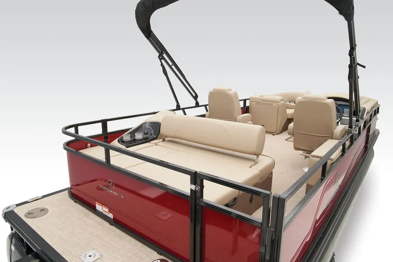 Slide: The Image of 2024 Regency 250 DL3 pontoon boat with beige seating and red exterior. - 41