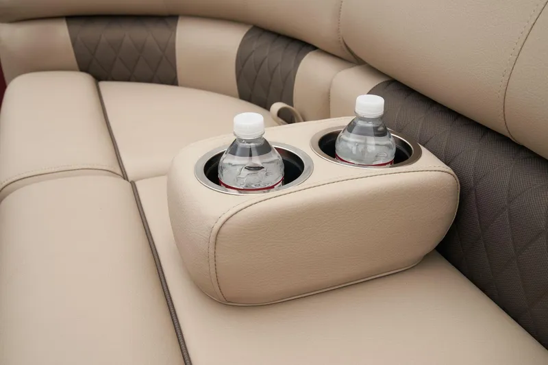 Slide: The Image of 2024 Sun Tracker Party Barge 22 XP3 cup holders on beige leather seats. - 23