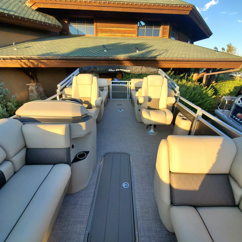 Slide: The Image of 2024 Sun Tracker Party Barge 22 XP3 pontoon boat with spacious seating and modern design. - 4