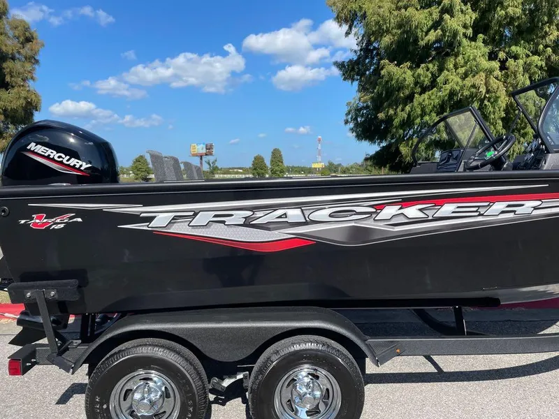 Slide: The Image of 2024 Tracker Targa V-18 Combo boat on trailer with Mercury engine. - 2