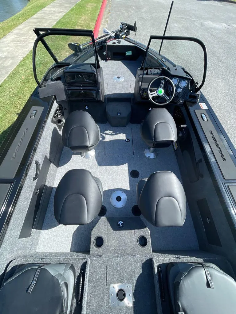 Slide: The Image of 2024 Tracker Targa V-18 Combo boat interior with seating and control panel. - 4