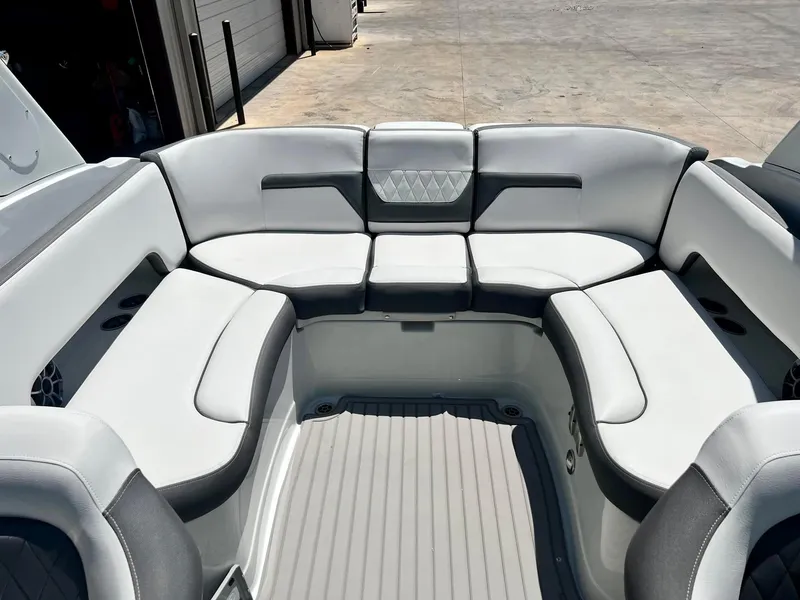 Slide: The Image of 2024 Crownline 270SS boat interior with spacious, cushioned seating in a sleek design. - 22