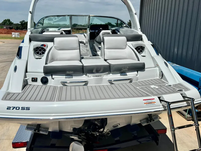 Slide: The Image of 2024 Crownline 270SS boat with sleek seating and modern design. - 6