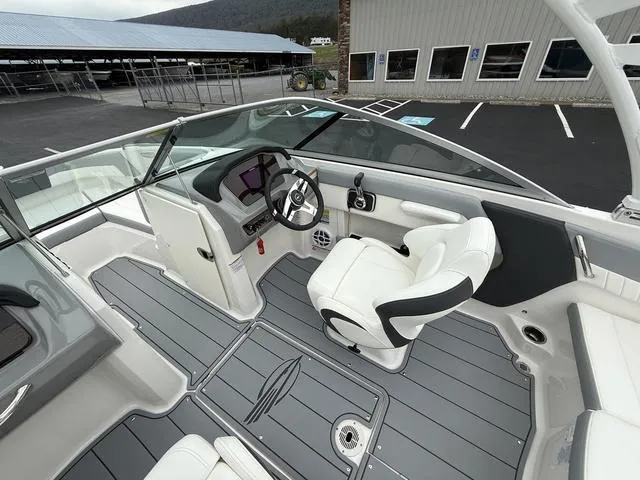 Slide: The Image of 2024 Chaparral 21 SSi boat interior with sleek design and modern dashboard. - 10