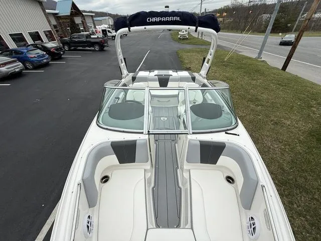 Slide: The Image of 2024 Chaparral 21 SSi boat with sleek design and spacious seating. - 14