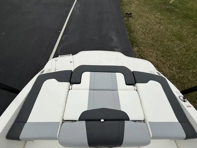 Slide: The Image of 2024 Chaparral 21 SSi boat with sleek gray and white seating design. - 6