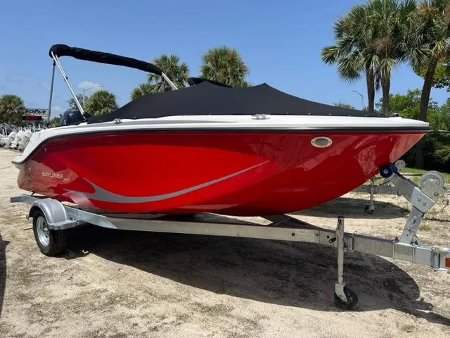 The Image of 2024 Bayliner Element M19 boat in red on a trailer. - 0