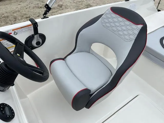 Slide: The Image of 2024 Bayliner Element M19 boat captain's seat and steering wheel. - 10