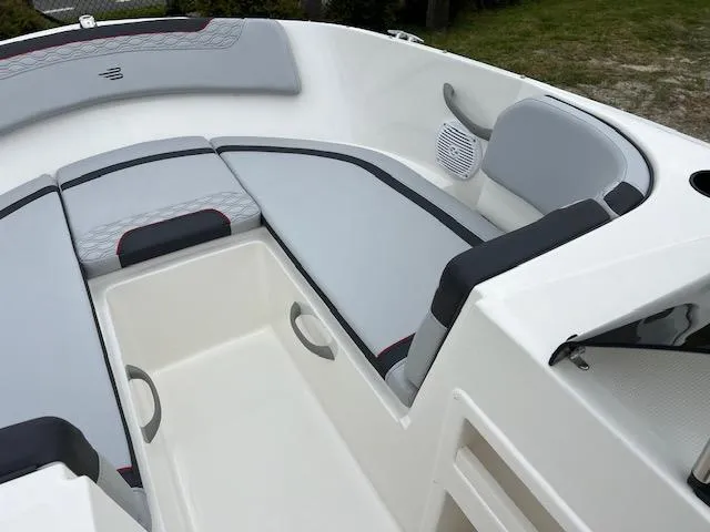 Slide: The Image of 2024 Bayliner Element M19 boat interior with cushioned seating and storage compartments. - 12