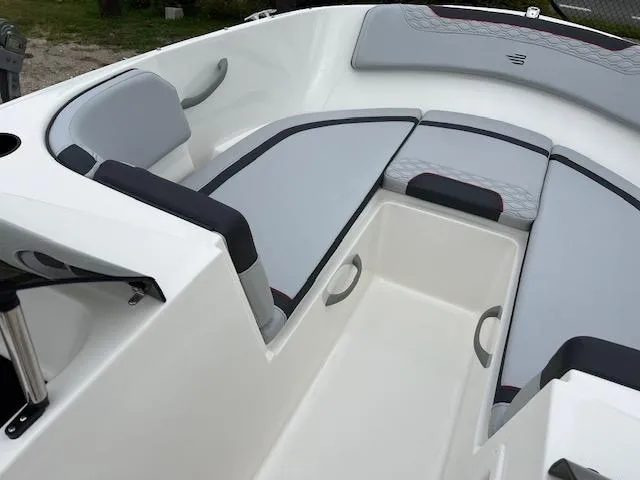 Slide: The Image of 2024 Bayliner Element M19 boat interior with gray and black seating. - 13