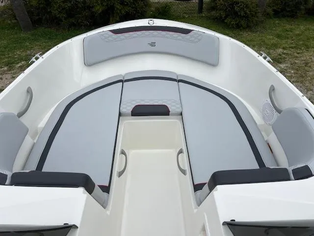 Slide: The Image of 2024 Bayliner Element M19 boat interior with cushioned seating. - 14
