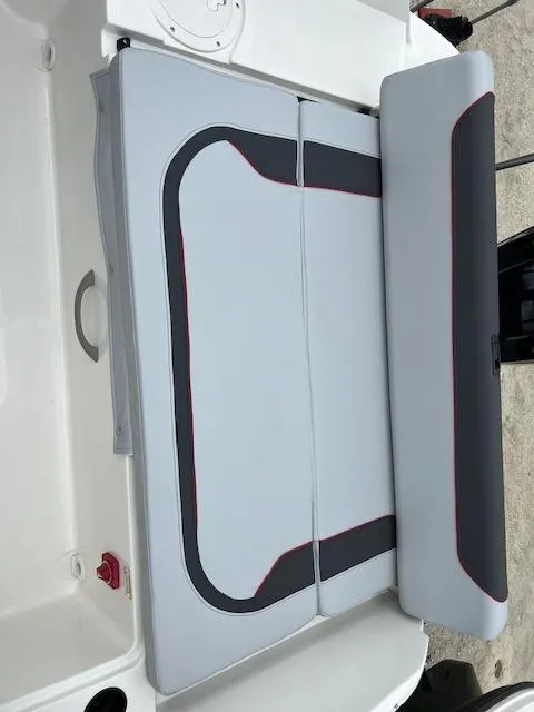 Slide: The Image of 2024 Bayliner Element M19 boat seating area with gray and black upholstery. - 5