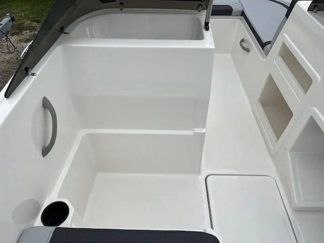 Slide: The Image of 2024 Bayliner Element M19 boat interior, spacious seating and storage compartments. - 7