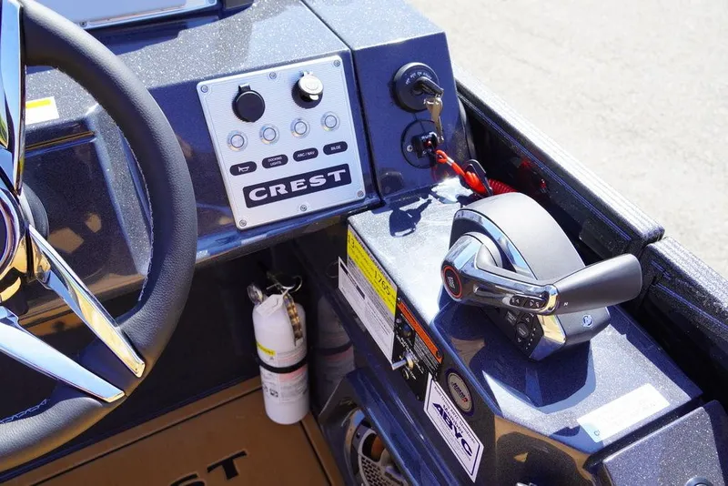 Slide: The Image of Control panel of 2024 Crest Savannah 250 SLSC CP3 (400 hp) boat with steering wheel and throttle. - 2