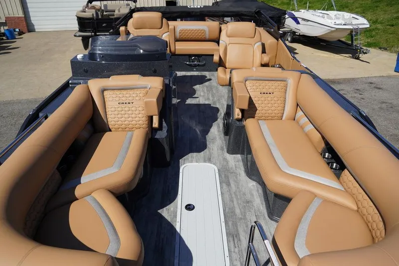Slide: The Image of 2024 Crest Savannah 250 SLSC CP3 boat interior with tan leather seating. - 3