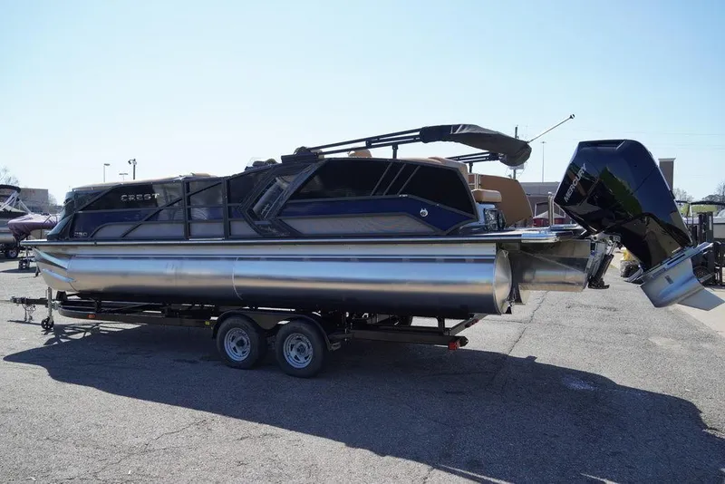 Slide: The Image of 2024 Crest Savannah 250 SLSC CP3 pontoon boat with 400 hp engine on trailer. - 4