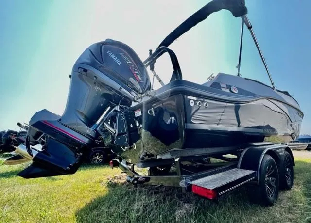 Slide: The Image of 2024 Starcraft SVX211 boat with Yamaha outboard motor on trailer. - 2