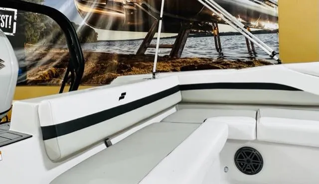 Slide: The Image of 2024 Starcraft SVX211 boat interior with white seating and black accents. - 5